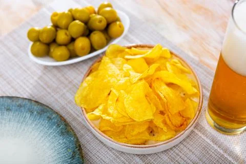 Image of chips, olives, beer Stock Photos