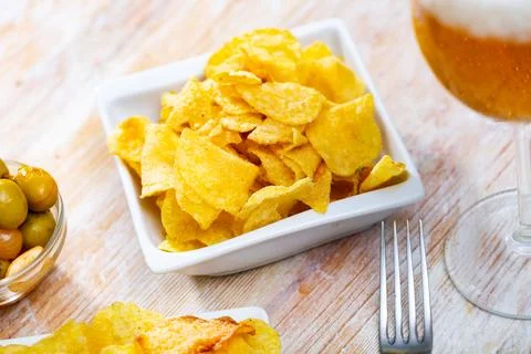Image of chips, olives, beer Stock Photos
