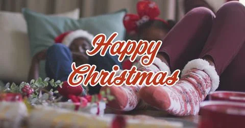 Image of christmas greetings text over african american family with christmas Stock Illustration