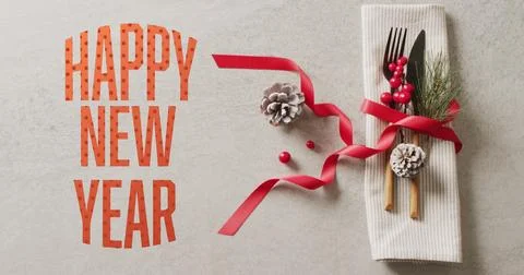 Image of christmas greetings text over christmas place setting and decorations Stock Illustration
