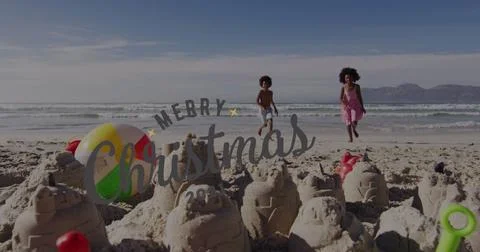 Image of christmas greetings text over african american children on beach Stock Photos