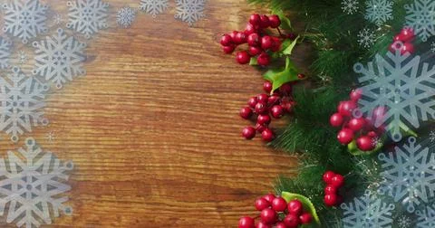 Image of christmas snowflake pattern over christmas decorations 스톡 사진