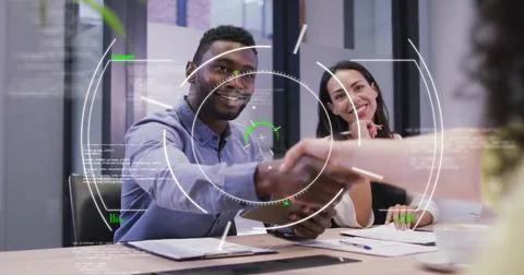 Image of circles and computer language over diverse entrepreneurs discussing and Stockfoto's