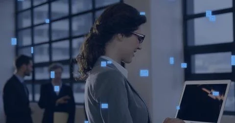Image of circuit board with data processing over caucasian woman using laptop Stock Photos