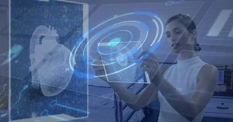 Image of circuit board, data processing over woman holding tablet Stock Photos