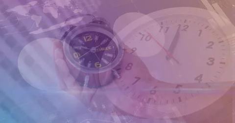 Image of clock and data processing over hand holding clock 写真素材