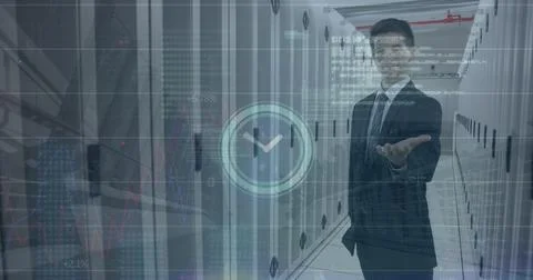 Image of clock icon over caucasian businessman holding an invisible object at Stock Photos
