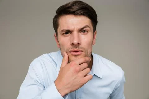 Image closeup of brooding serious man wearing formal clothes looking at camer Stock Photos