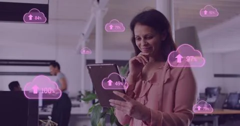 Image of cloud data processing over businesswoman in office Stock Photos