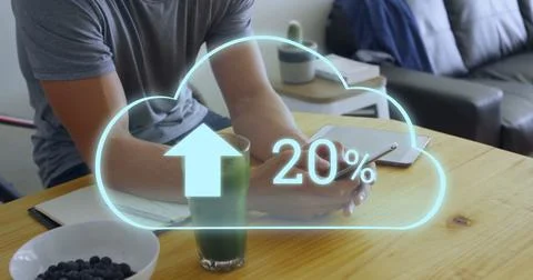 Image of cloud with growing number over caucasian man using smartphone Stock Photos