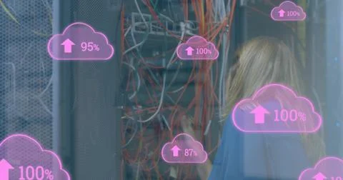 Image of cloud icons with growing numbers over caucasian woman in server room Stockfoto's