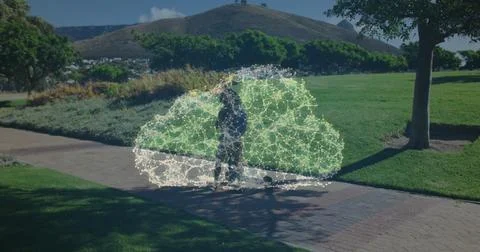 Image of cloud made of connections over woman walking with scooter in a park Stock Photos