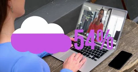 Image of cloud upload icon against rear view of woman having a image call on Stock Photos