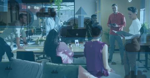 Image of clouds with arrows icons over diverse colleagues talking in office Stock Photos