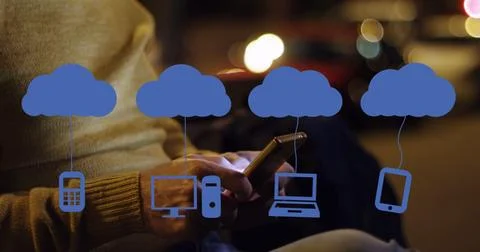 Image of clouds with electronic devices over caucasian man using smartphone Stock Photos