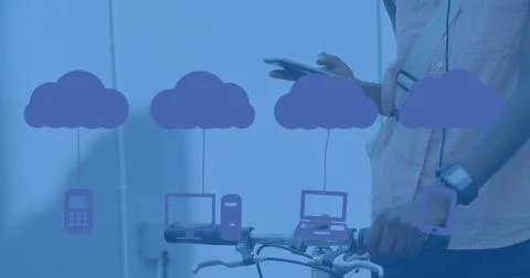 Image of clouds with electronic devices over caucasian man using smartphone Stock Photos