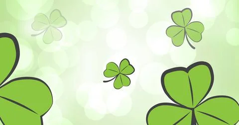 Image of clover leaves falling over white spot lights on green background Illustrazione stock