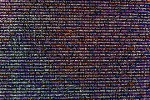Image of a code editor displaying blurry lines of computer programming code.. Stock Photos