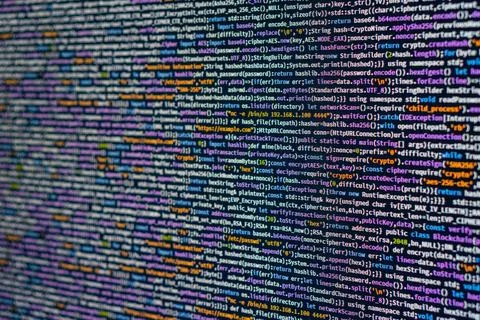Image of a code editor displaying blurry lines of computer programming code.. Stock Photos