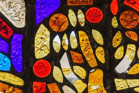 Image of a colored stained glass window with irregular block pattern Stock Photos