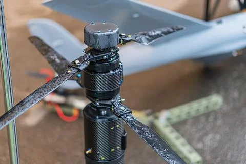 Image of a combat quadcopter drone, centrally positioned with a front-mounted Stock Photos