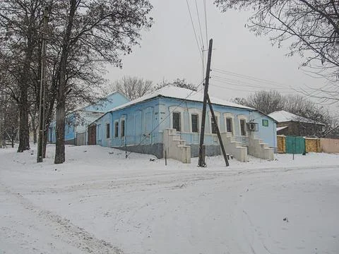 Image of a composite showing winter on left snow, overcast sky, house and pos 스톡 사진