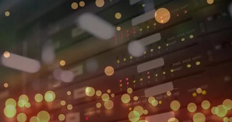 Image of computer language and falling lens flares over multiple modems in .. 写真素材