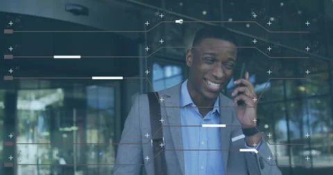 Image of computer language and lines over african american businessman talk.. 写真素材