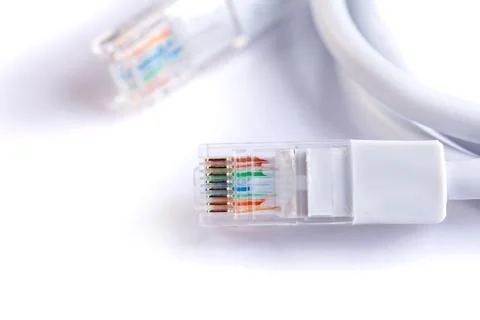 An image of computer network cable on white background Stock Photos