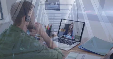 Image of computer servers over man using laptop on image call Stock Photos