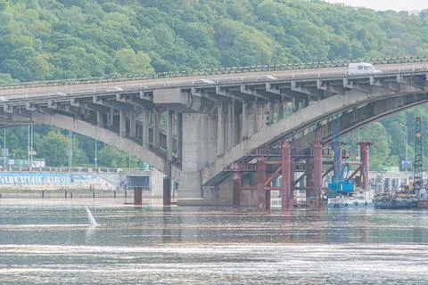 Image of a concrete bridge with multiple arches over the Dnepr River in Kiev  Stock Photos