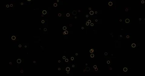 Image of confetti falling and circles pattern moving on black background Stock Illustration