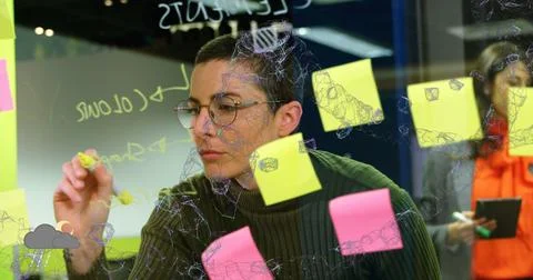 Image of connected dots forming abstract shape over caucasian woman writing.. Foto stock