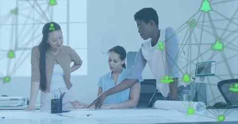 Image of connected icons forming globe over diverse female architects discussing Stock Photos