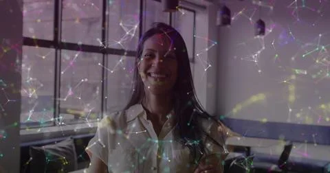 Image of connections and data processing over biracial businesswoman in office Stock Photos