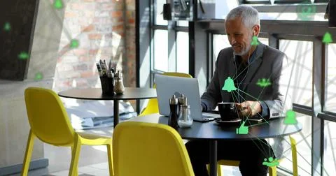 Image of connections with data processing over caucasian man using laptop Stock Photos