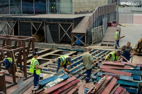 Image of construction site with workers and materials for new business building Stock Photos