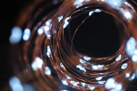 Image of copper wire led lights on dark background Stock Photos