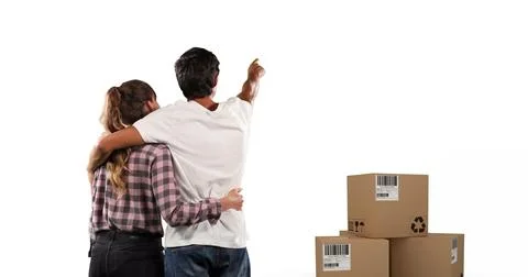 Image of couple embracing with stack of boxes on white background Foto stock