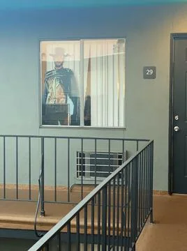 Image of a cowboy inside the apartment window Stock-Fotos