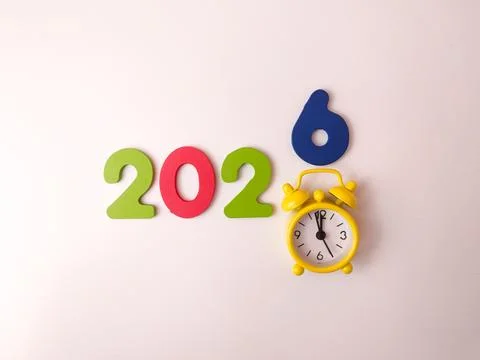 The image is a creative flat lay display of colorful numbers and a yellow a.. Stock Photos