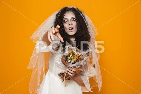 Image of creepy bride zombie on halloween wearing wedding dress and scary mak Stock Photos