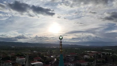 Image of the crescent representing Islam on the mosque minaret on a cloudy day Stock Footage 256573321