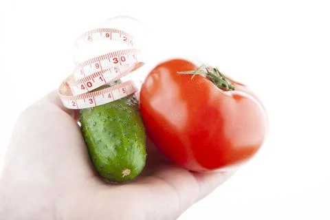 Image of cucumber tomato hand white background Stock Photos