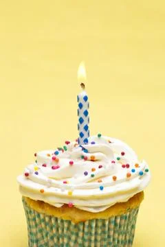 Image of a cupcake with candle Stock Photos