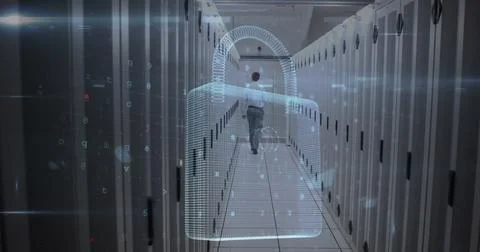 Image of cyber attack warning and padlock over caucasian man in server room Stockfoto's