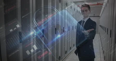 Image of cyber attack warning and padlock over caucasian man in server room Stockfoto's