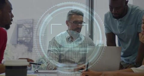 Image of cyber security text and retina scanner over diverse colleagues Stock Photos