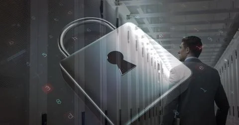 Image of cyberattack and padlock icon over caucasian man in server room Stockfoto's