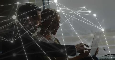 Image of data and network of connections over caucasian businesspeople using Stock Photos